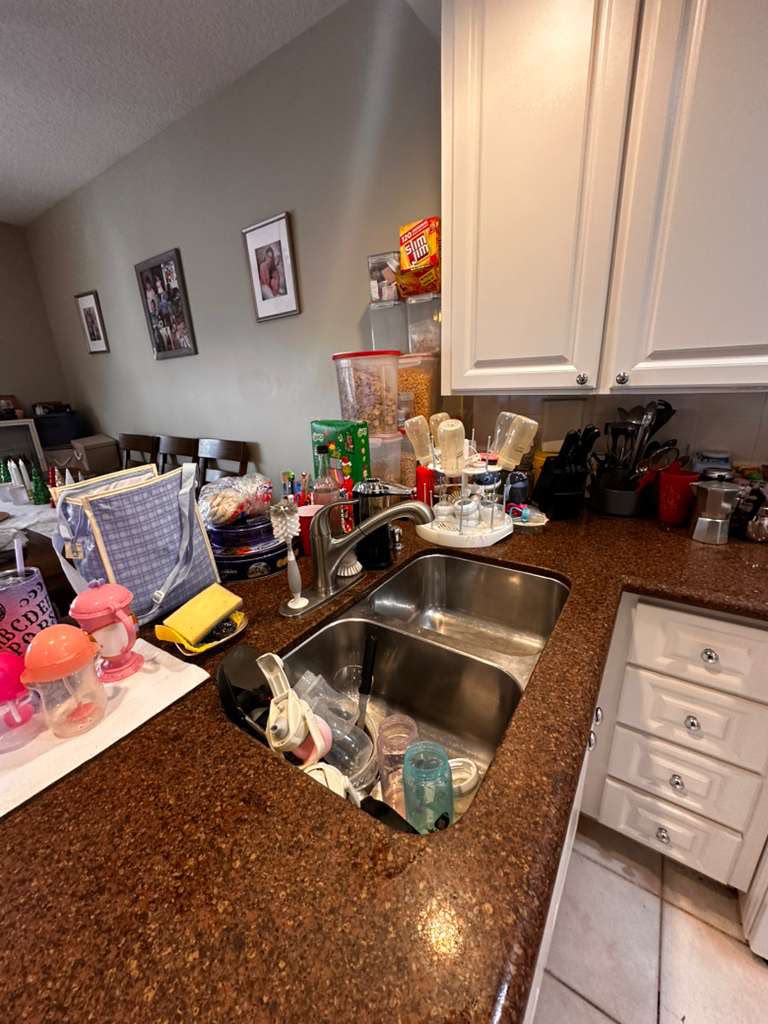Messy living room before professional Airbnb turnover cleaning