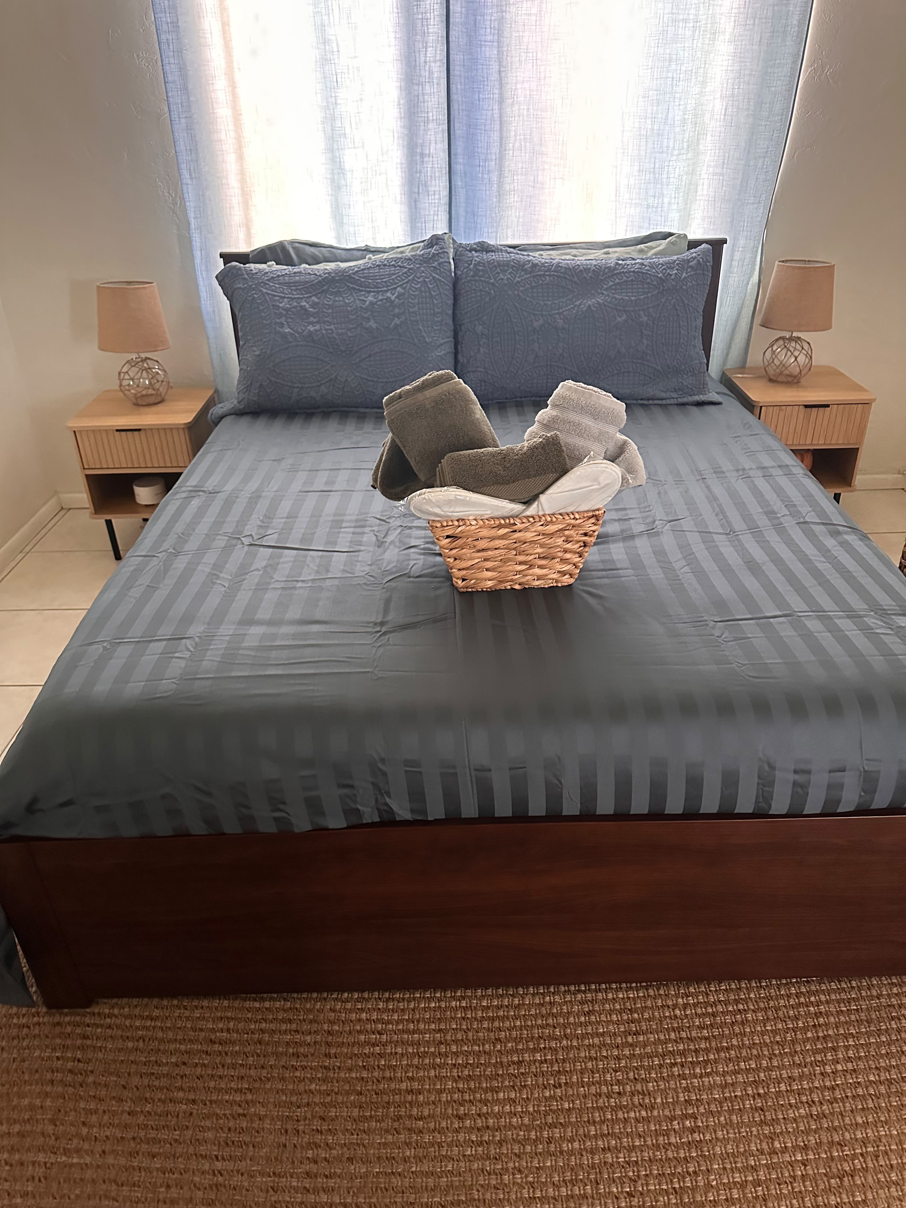 Fresh bed linens and towels prepared for Airbnb guests