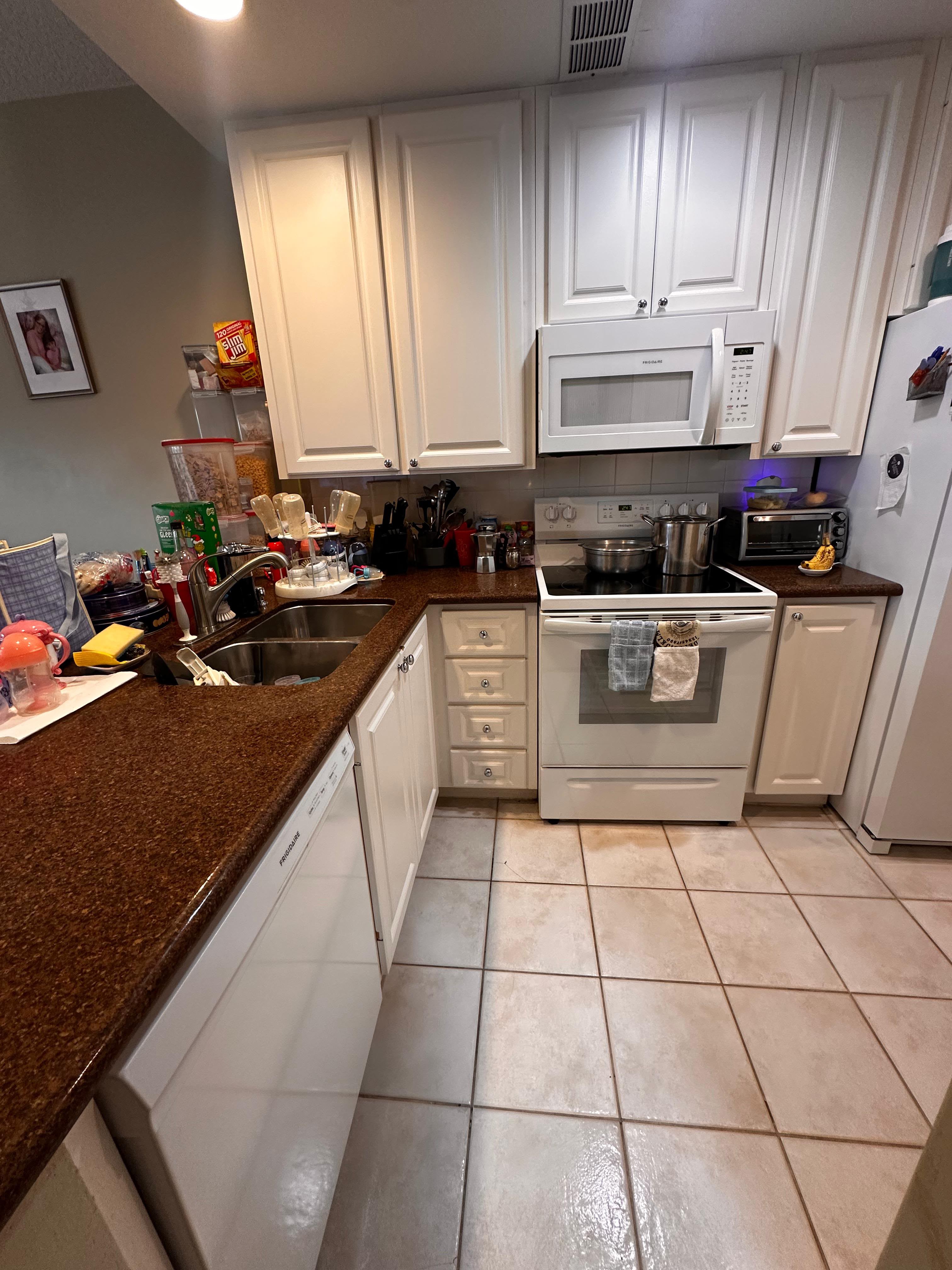 Rosie's team sanitizing kitchen countertops