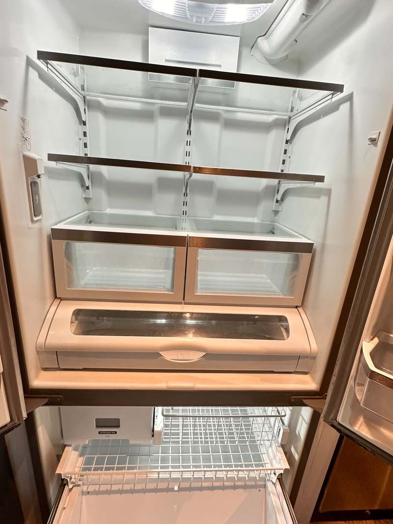 Refrigerator cleaned inside during a deep cleaning